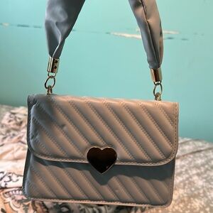 Sky blue bag with heart charm
